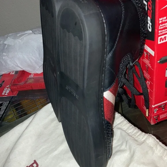 Bally Shoes size 10 ..mostly all black with 2 red stripes and one white stripe
